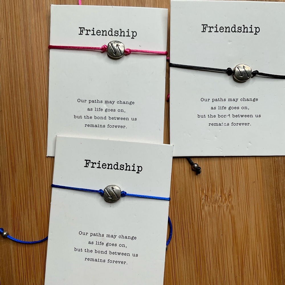 NWT Friendship bracelets, blue, black, or red w/ silver charm